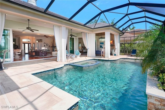 view of pool with a ceiling fan, a patio area, an outdoor hangout area, a pool with connected hot tub, and glass enclosure