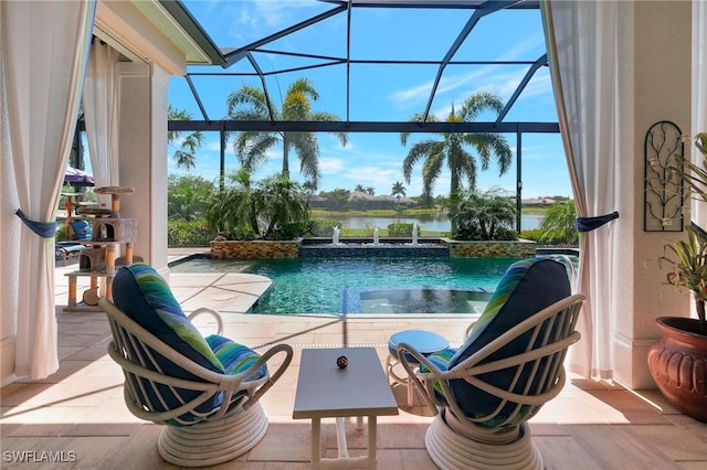 view of pool with a water view, a patio, and a lanai