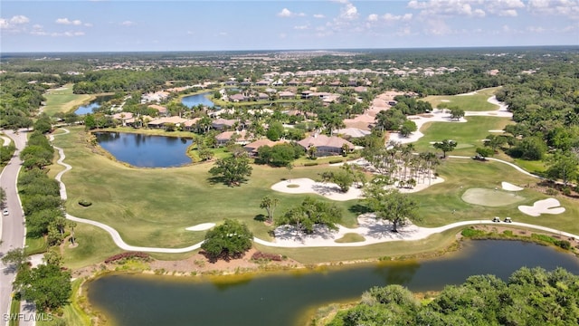 aerial view with a residential view, view of golf course, and a water view