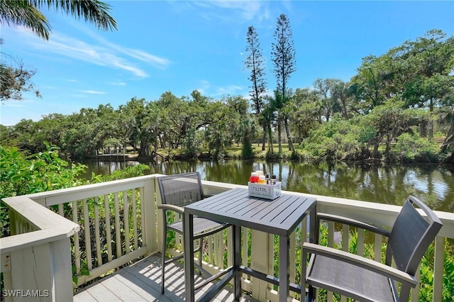 wooden deck featuring a water view
