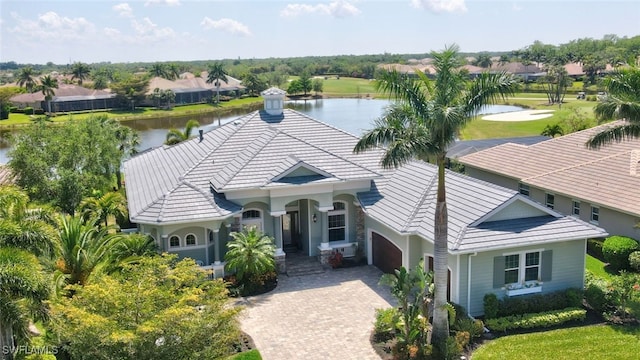 birds eye view of property with a water view