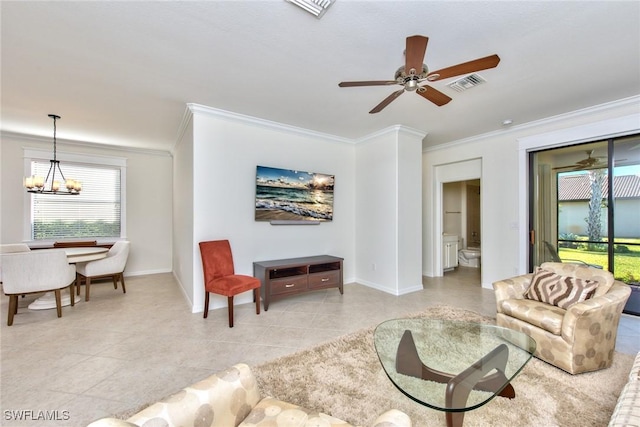 living area with light tile patterned flooring, ceiling fan with notable chandelier, visible vents, and ornamental molding