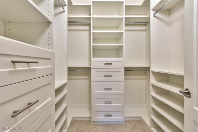 walk in closet featuring light tile patterned floors