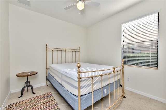 bedroom featuring light tile patterned floors, multiple windows, and visible vents