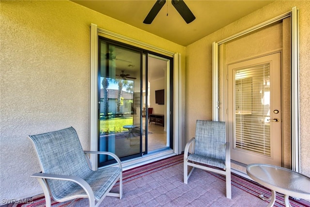 exterior space featuring ceiling fan
