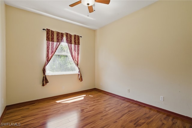 510 13th St NW, Naples, FL 34120 - spare room featuring baseboards, ceiling fan, and wood finished floors