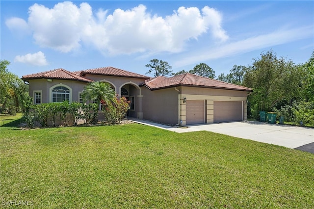 510 13th St NW, Naples, FL 34120 - mediterranean / spanish house featuring a tile roof, stucco siding, a front yard, and a garage