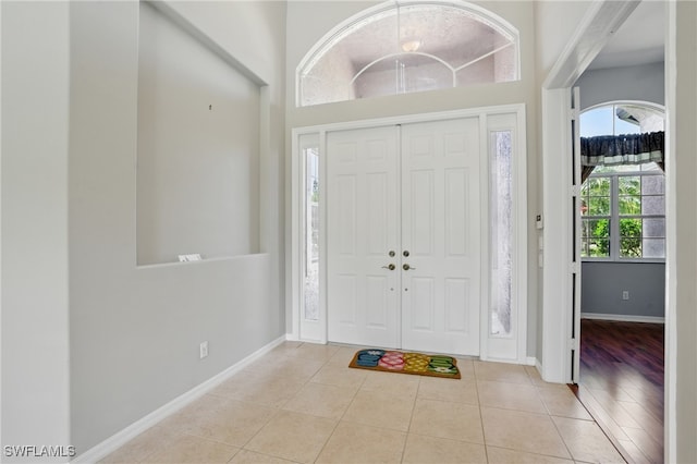 510 13th St NW, Naples, FL 34120 - tiled foyer entrance with baseboards and a high ceiling