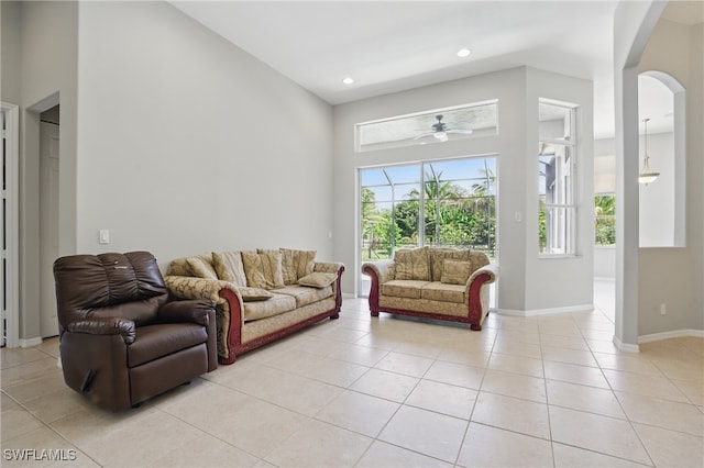 510 13th St NW, Naples, FL 34120 - living room with recessed lighting, baseboards, light tile patterned flooring, arched walkways, and a ceiling fan