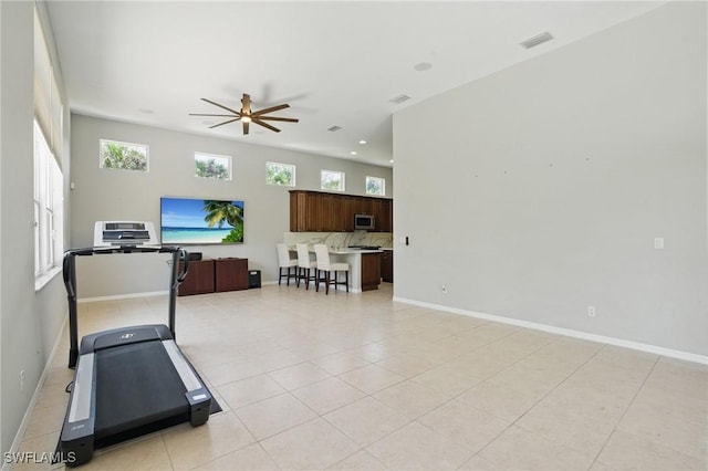 510 13th St NW, Naples, FL 34120 - workout room with a ceiling fan, light tile patterned floors, baseboards, and visible vents