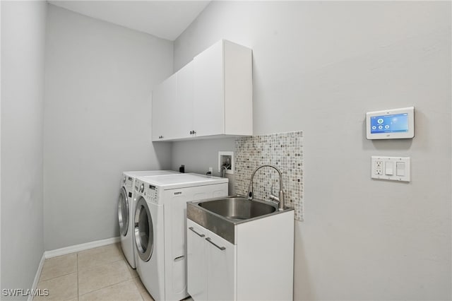 510 13th St NW, Naples, FL 34120 - clothes washing area featuring independent washer and dryer, baseboards, a sink, cabinet space, and light tile patterned floors