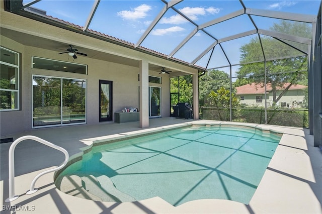 510 13th St NW, Naples, FL 34120 - outdoor pool with a ceiling fan, glass enclosure, and a patio area