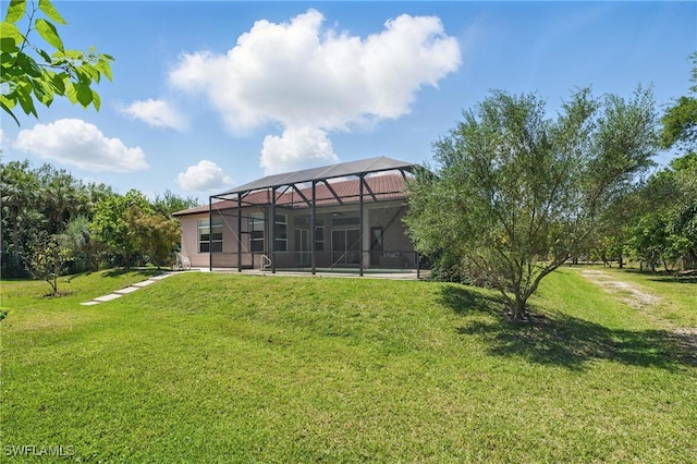 510 13th St NW, Naples, FL 34120 - view of yard featuring glass enclosure