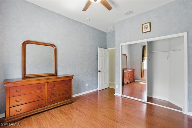 510 13th St NW, Naples, FL 34120 - bedroom featuring visible vents, baseboards, a closet, and wood finished floors