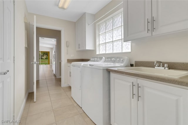 7933 Umberto Ct, Naples, FL 34114 - laundry room featuring a sink, washing machine and clothes dryer, light tile patterned floors, baseboards, and cabinet space