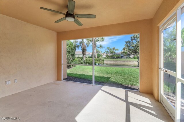 7933 Umberto Ct, Naples, FL 34114 - unfurnished sunroom with concrete floors and ceiling fan