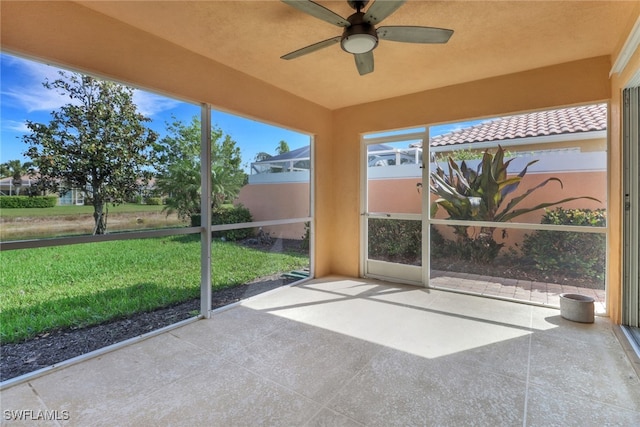7933 Umberto Ct, Naples, FL 34114 - unfurnished sunroom featuring a ceiling fan
