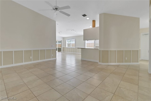 7933 Umberto Ct, Naples, FL 34114 - empty room with light tile patterned floors, baseboards, ceiling fan, and visible vents