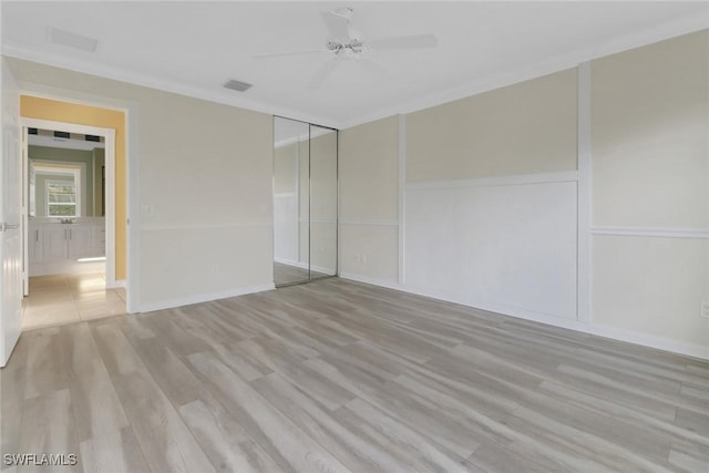 7933 Umberto Ct, Naples, FL 34114 - unfurnished bedroom with visible vents, crown molding, wood finished floors, and ceiling fan