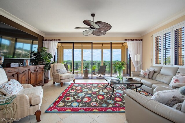 living area with a healthy amount of sunlight, ceiling fan, and light tile patterned flooring