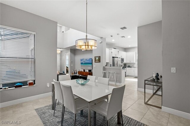 1338 Kendari Ter, Naples, FL 34113 - dining room featuring visible vents, baseboards, light tile patterned floors, an inviting chandelier, and recessed lighting