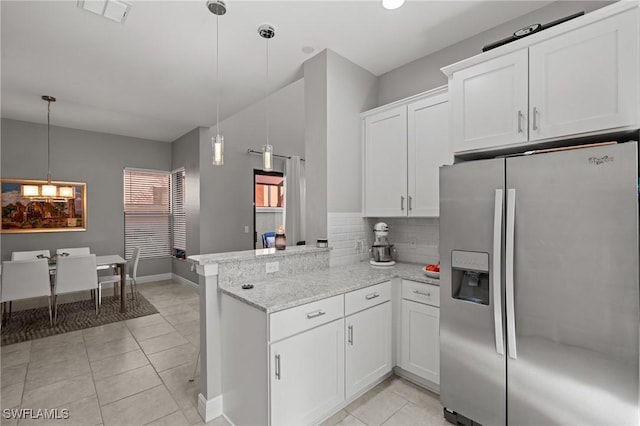 1338 Kendari Ter, Naples, FL 34113 - kitchen with visible vents, stainless steel refrigerator with ice dispenser, a peninsula, white cabinetry, and backsplash