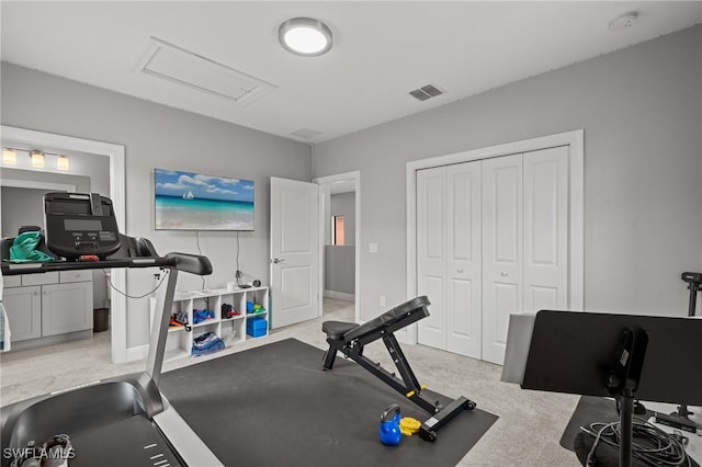 1338 Kendari Ter, Naples, FL 34113 - exercise room featuring light carpet, visible vents, and attic access