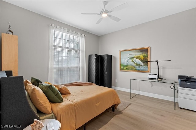 1338 Kendari Ter, Naples, FL 34113 - bedroom with baseboards, light wood-type flooring, and a ceiling fan