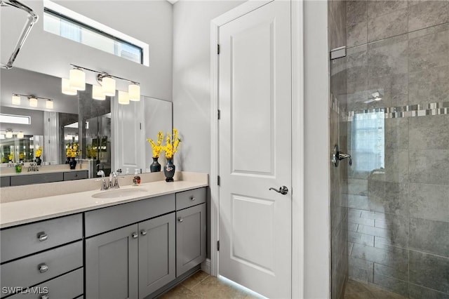 1338 Kendari Ter, Naples, FL 34113 - full bath featuring tile patterned floors, tiled shower, and vanity