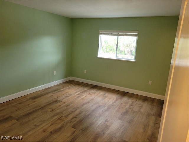 9395 Pennsylvania Ave Unit 10, Bonita Springs, FL 34135 - unfurnished room with wood finished floors and baseboards