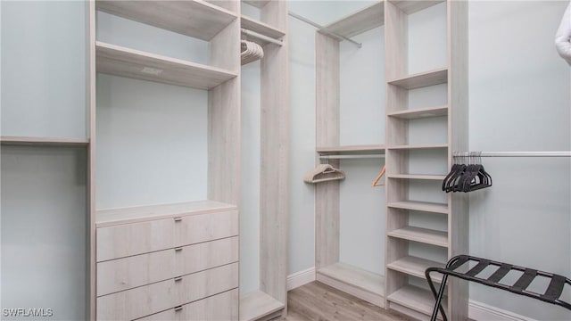 162 Windward Cay, Naples, FL 34114 - spacious closet featuring wood finished floors