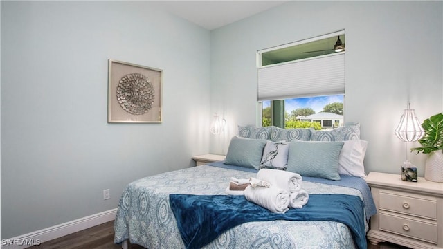 162 Windward Cay, Naples, FL 34114 - bedroom with dark wood-style flooring and baseboards