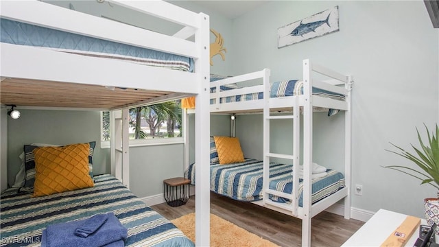 162 Windward Cay, Naples, FL 34114 - bedroom with baseboards and wood finished floors