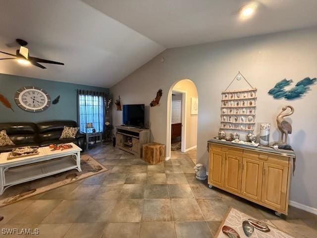 408 SE 19th Ln, Cape Coral, FL 33990 - living room featuring arched walkways, vaulted ceiling, and a ceiling fan