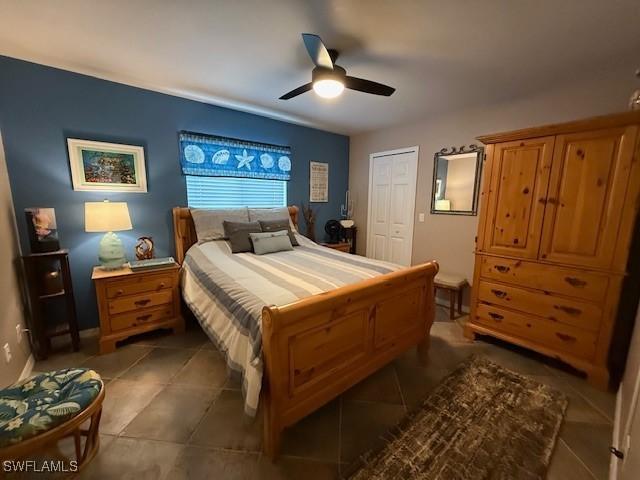 408 SE 19th Ln, Cape Coral, FL 33990 - bedroom with tile patterned floors, a closet, and a ceiling fan