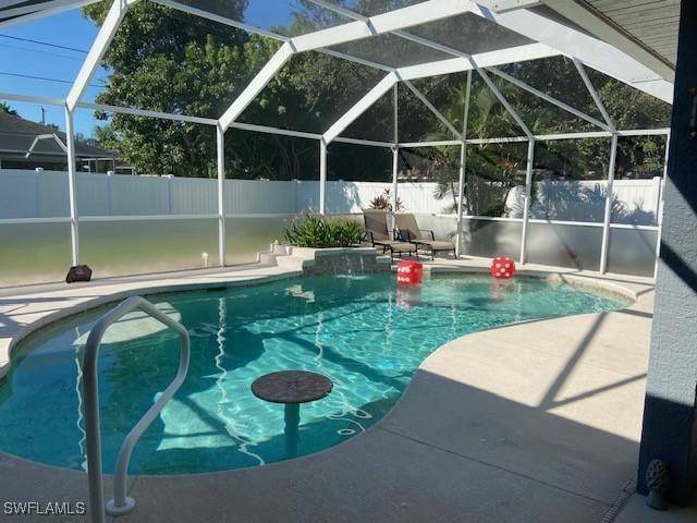 408 SE 19th Ln, Cape Coral, FL 33990 - view of pool featuring a patio area, fence, and a fenced in pool