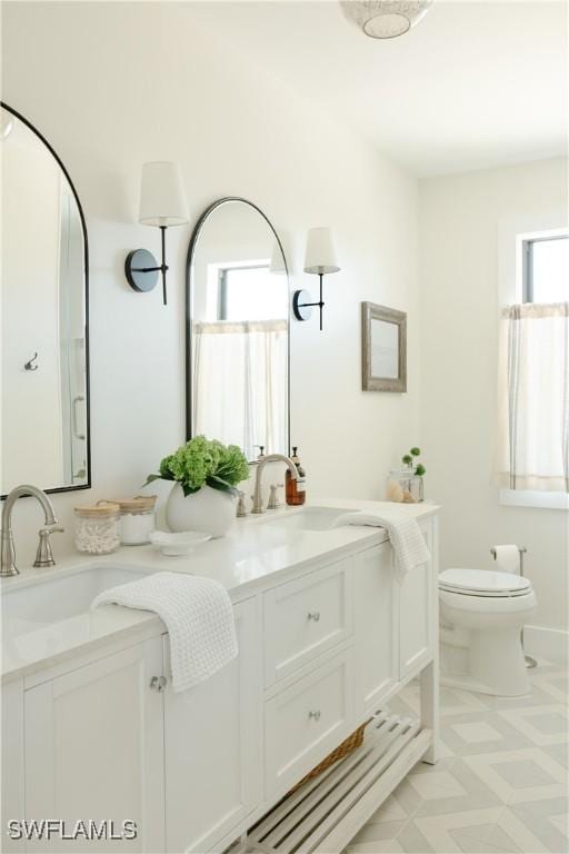 167 1st St, Bonita Springs, FL 34134 - full bathroom featuring double vanity and toilet