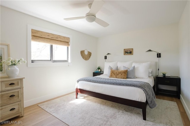 167 1st St, Bonita Springs, FL 34134 - bedroom with a ceiling fan, baseboards, and light wood-type flooring