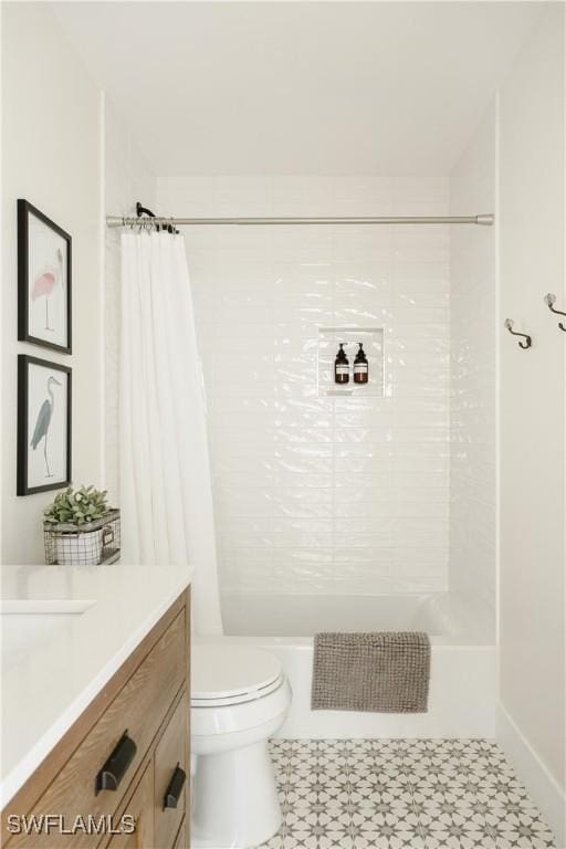 167 1st St, Bonita Springs, FL 34134 - full bath featuring shower / bath combo with shower curtain, vanity, and toilet