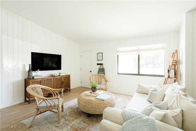 167 1st St, Bonita Springs, FL 34134 - living area with baseboards and light wood-type flooring