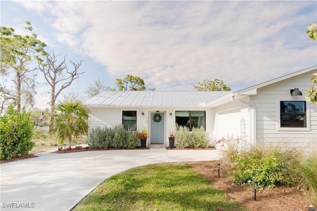 167 1st St, Bonita Springs, FL 34134 - single story home featuring an attached garage and concrete driveway
