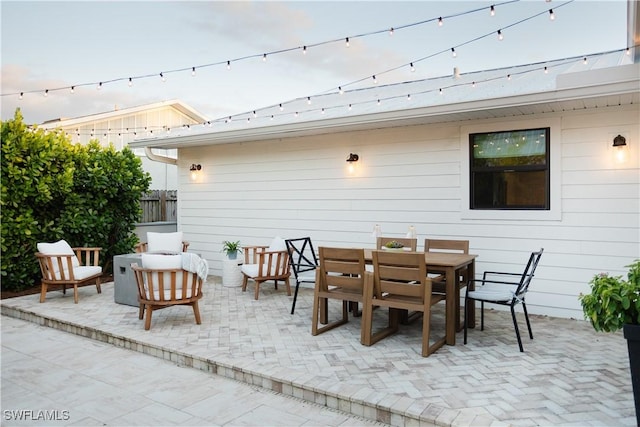 167 1st St, Bonita Springs, FL 34134 - view of patio with outdoor dining area and fence