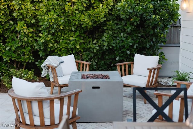 167 1st St, Bonita Springs, FL 34134 - view of patio / terrace with an outdoor fire pit
