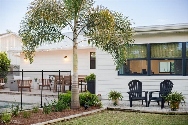 167 1st St, Bonita Springs, FL 34134 - back of property with a patio area