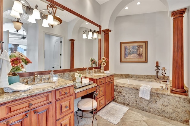 159 Geranium Ct, Marco Island, FL 34145 - full bathroom with ornate columns, double vanity, a garden tub, tile patterned floors, and recessed lighting