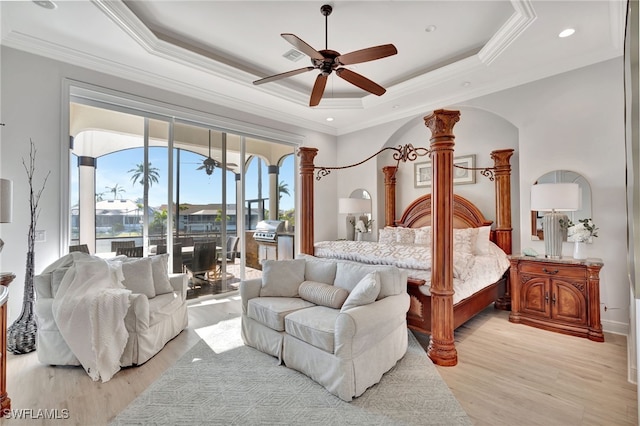 159 Geranium Ct, Marco Island, FL 34145 - bedroom with access to outside, a tray ceiling, ornamental molding, ornate columns, and light wood-type flooring