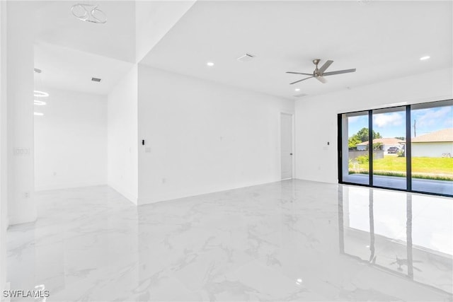 empty room with recessed lighting, marble finish floor, and ceiling fan