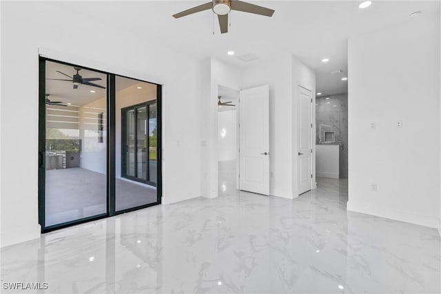 interior space with baseboards, marble finish floor, and ceiling fan