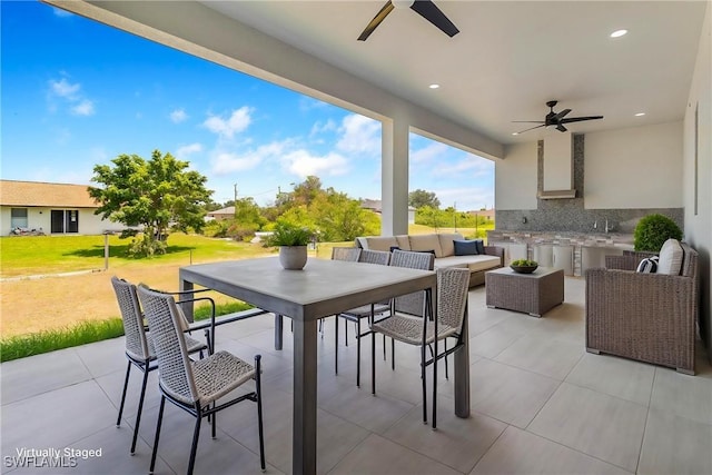 view of patio / terrace featuring a ceiling fan and outdoor lounge area