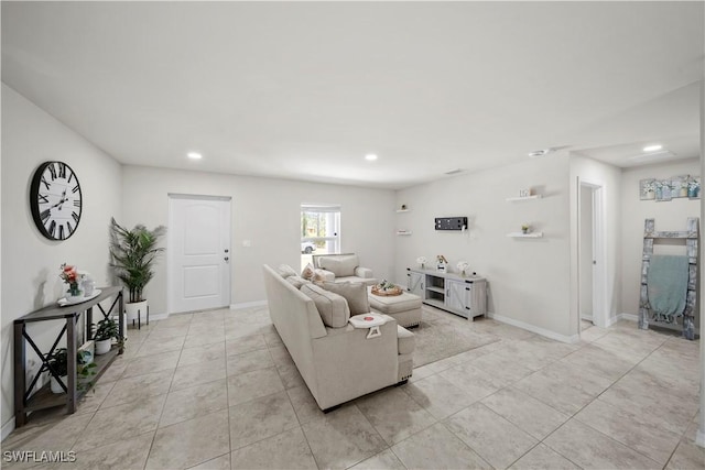 living room with baseboards, recessed lighting, and light tile patterned floors